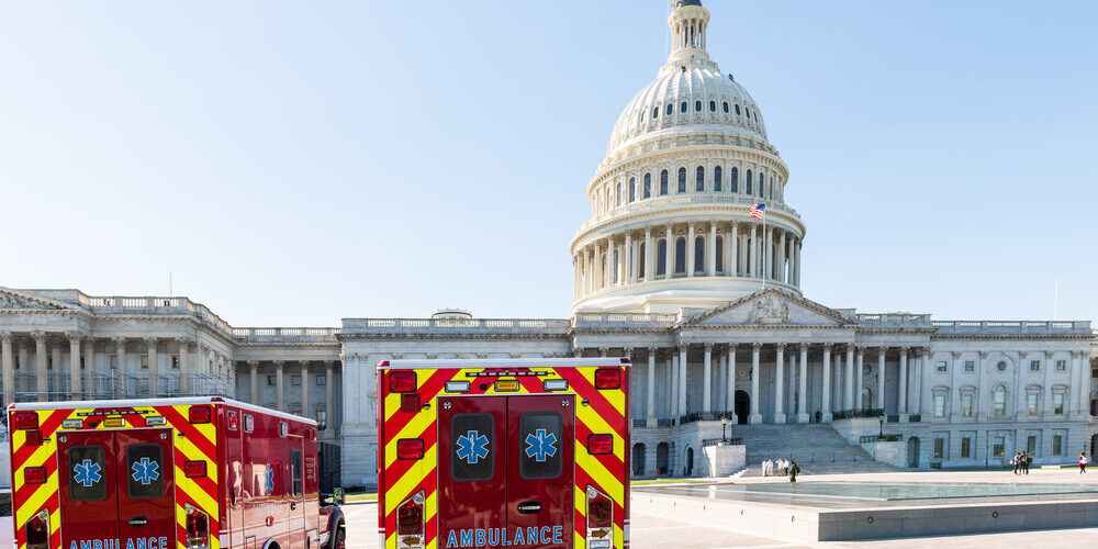Washington DC, USA – October 12, 2018: US Congress dome construction exterior on Capital capitol hill with ambulance red fire trucks